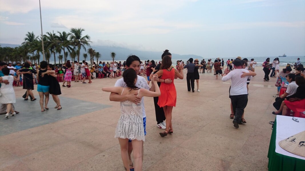 Dancing Argentine tango on the plaza on My Khe beach, Da Nang