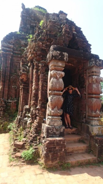 The temple buildings have thick walls and no windows, making them surprisingly cool. Not as cool as Ti, though, doing her best 'Audrey Hepburn'